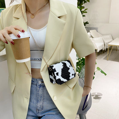 Damenmode Koreanische Version der Lippenstifttasche im westlichen Stil mit Kuhmusterkette